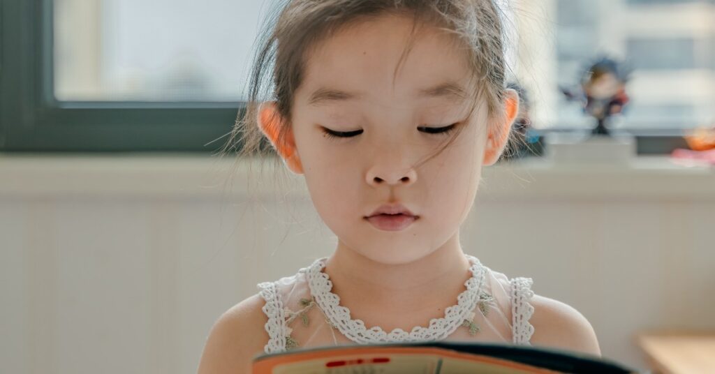 image of young girl reading